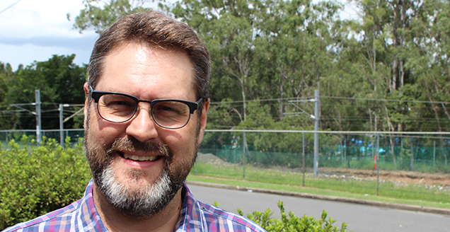 Headshot of Paul Blom, male with glasses and beard smiling