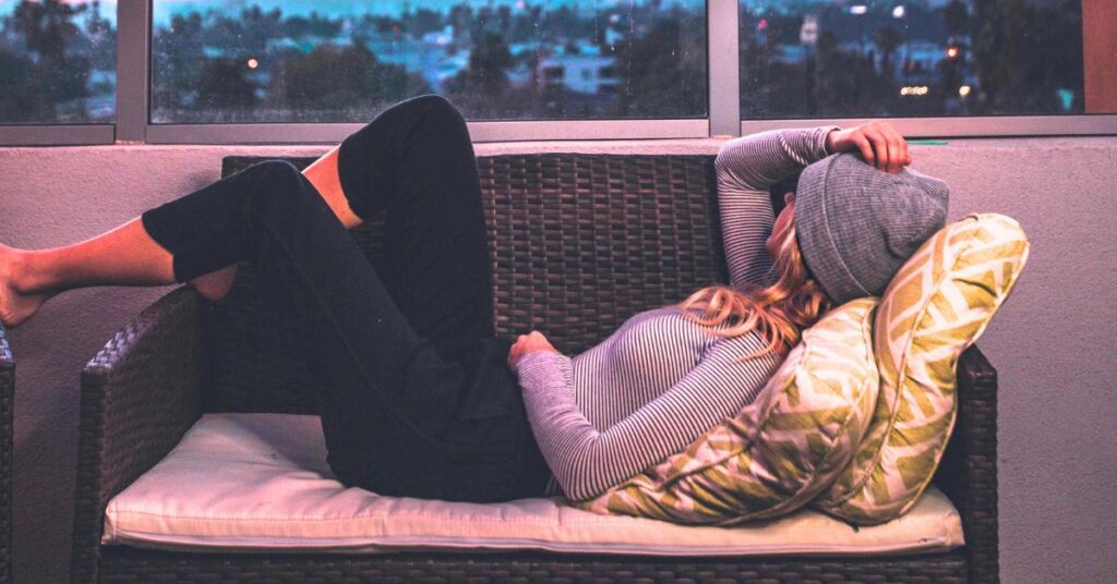 Young woman relaxing on couch