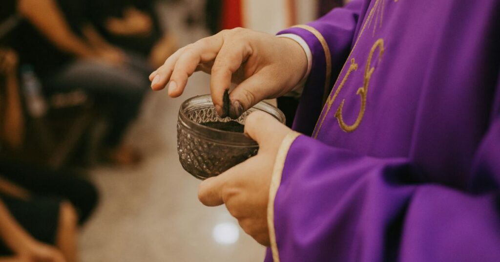 Priest with ash on Ash Wednesday 